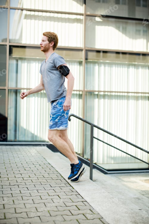 Preview: Young man running in the urban area