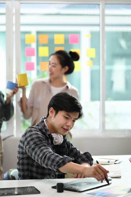 Preview: Portrait of creative start up team working on project together in modern office.