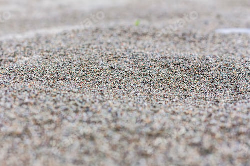Preview: Close-up of texture beige or multi-colored fine sand with copy space.