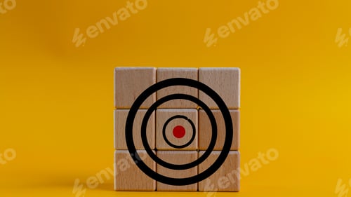Preview: Target icon on wooden cubes, yellow background. Target concept