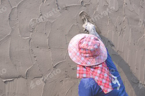 Preview: Construction Worker using Trowel to Plastering Concrete Fence Wall, Rear view