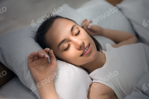 Preview: Young Woman Sleeping In Bed Comfortably And Blissfully