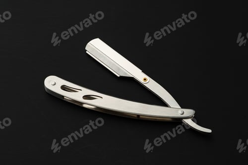 Preview: Barber shaving blade on black background close up