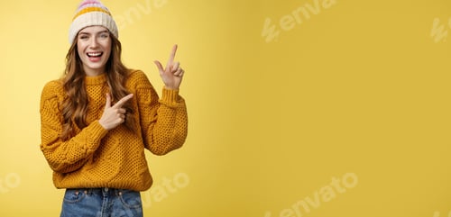 Preview: Smiling Woman Points with Cheerfulness in Studio Setting