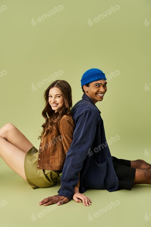 Preview: Young stylish couple enjoying a cozy autumn day together in vibrant outfits