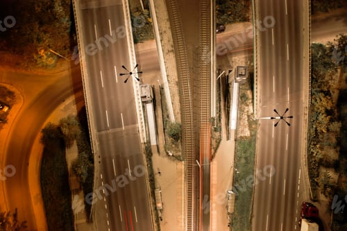 Preview: Top down view to road. Romantic night aerial photo of cars traveling. The light on the road at night