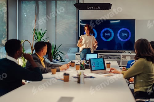 Preview: Hispanic woman boss holding a meeting in a modern office