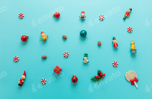 Preview: Christmas minimal flat lay. Xmas decoration, baubles and ornaments variety on blue color background