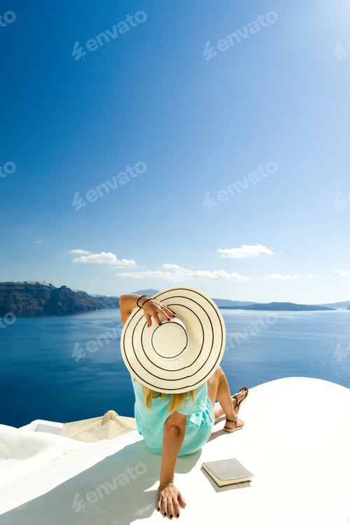 Preview: Woman on holidays in Santorini Greece
