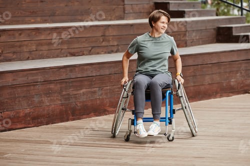 Preview: Woman riding on wheelchair outdoors