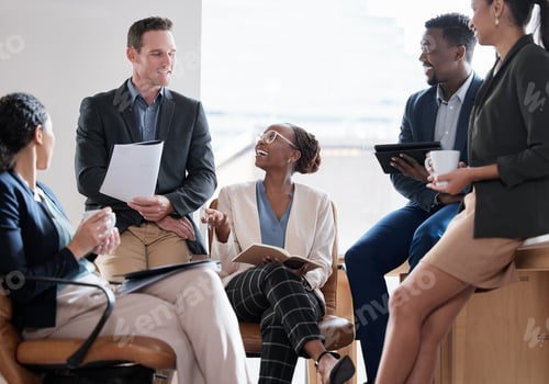 Preview: Would you like to say something. Shot of a group of businesspeople in a meeting at work.