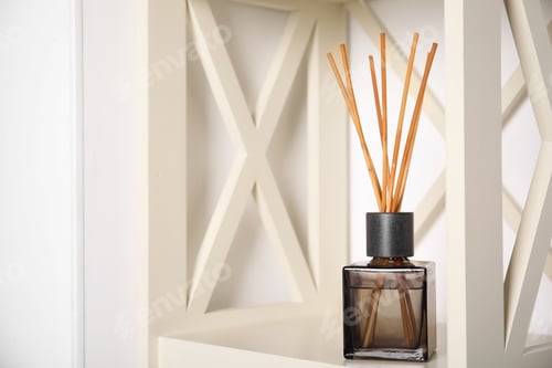 Preview: Aromatic reed freshener on wooden shelf indoors, space for text