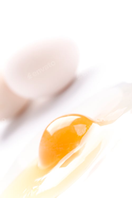 Preview: whole and broken white chicken eggs