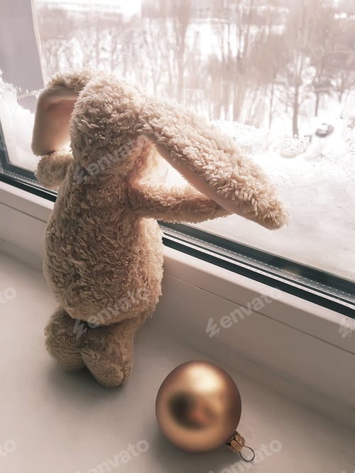 Preview: Stuffed Bunny Looking Out Snowy Window