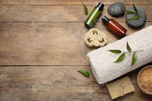 Preview: Flat lay spa composition with skin care products on wooden table, space for text