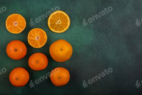 Preview: top view copy space oranges with grapefruit and tangerines on green background