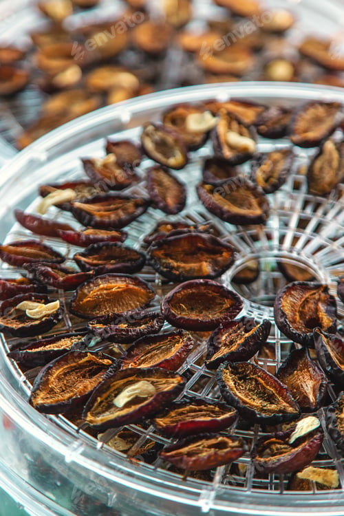 Preview: Plums dried in a dehydrator. Selective focus.