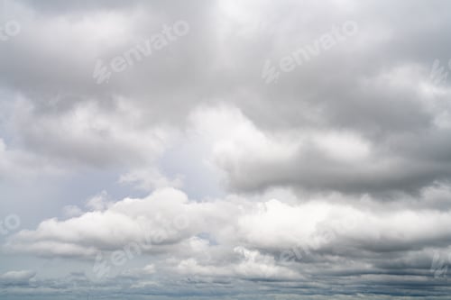 Preview: Dramatic overcast sky with gray and white clouds before rainy season storm, moody and gloomy weather