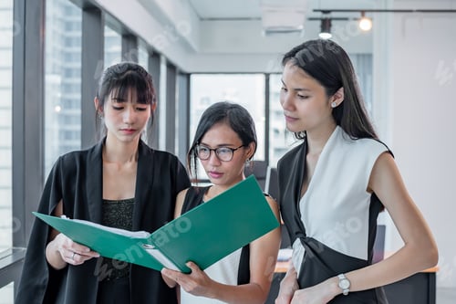 Preview: asian Business three woman look document folder in modern office