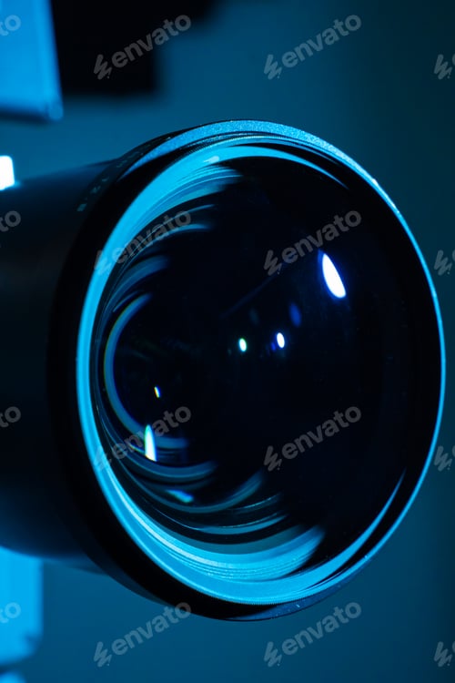 Preview: Close-up of a digital camera lens with dark light. Copy space for text vertical.