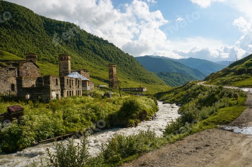 Preview: old weathered buildings against small river stream against hills, Ushguli, svaneti, georgia