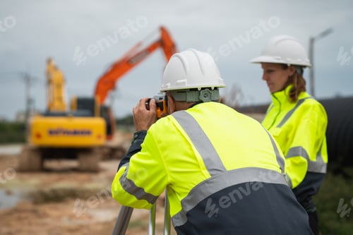 Preview: The survey team is using a theodolite and road construction plans.