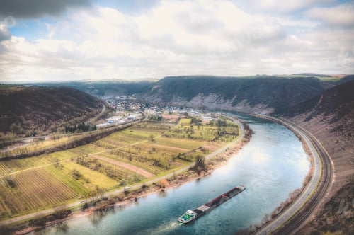 Preview: Beautiful view of the river flowing between the hills, the sailing barge