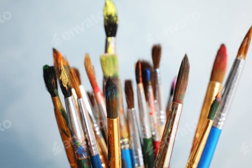 Preview: Different paint brushes on light background, closeup
