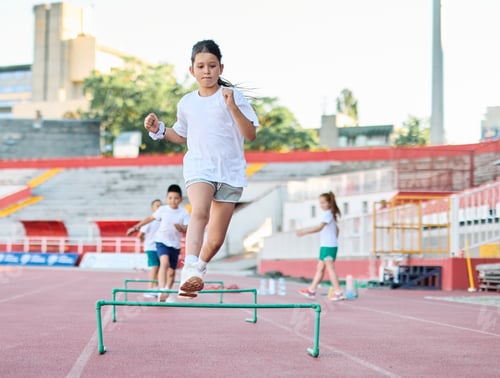 Preview: Children having sport exercise training class outdoors