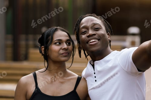Preview: a happy black male and female in love, cheerful couple outdoors