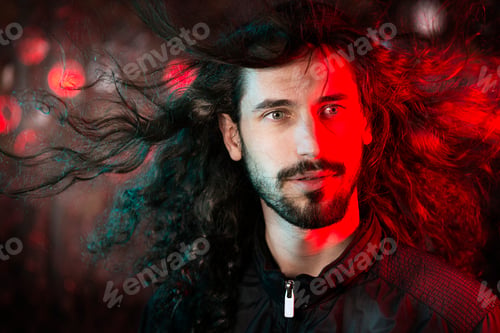 Preview: Portrait of bearded young man tossing his long hair