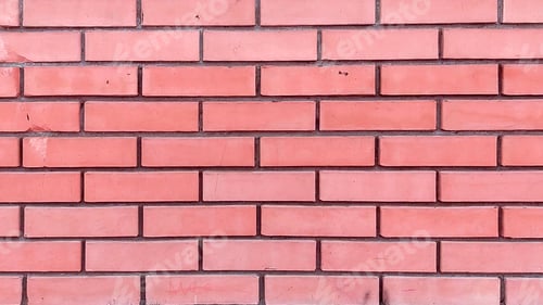 Preview: Close-up of the facade of a modern yellow brick building with a brown stone foundation