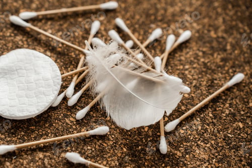 Preview: Cotton Pads and Wooden Cotton Swabs on Cork Surface