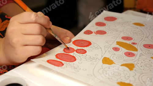 Preview: Child paints watercolor picture with paint brush