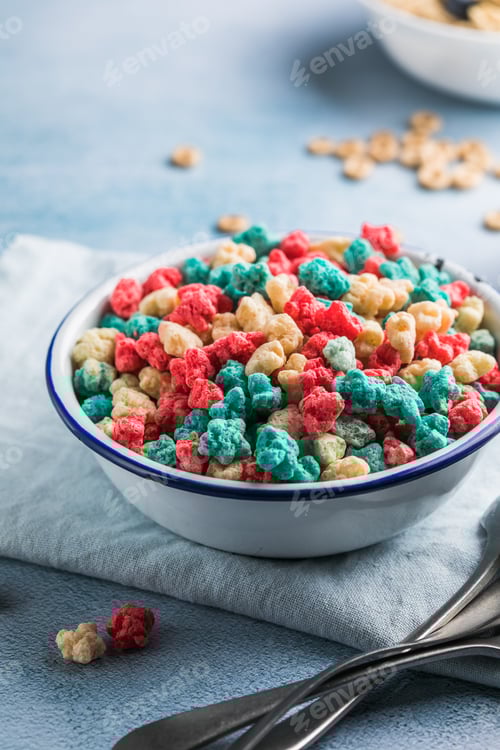 Preview: Colorful Cereal in Bowl on Blue Background