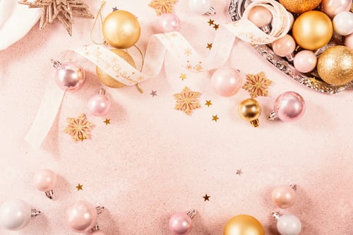 Preview: Festive Christmas and New Year background with gold and pink baubles and ribbons