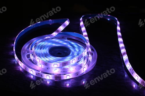 Preview: Closeup shot of purple LED strip lights isolated on black background