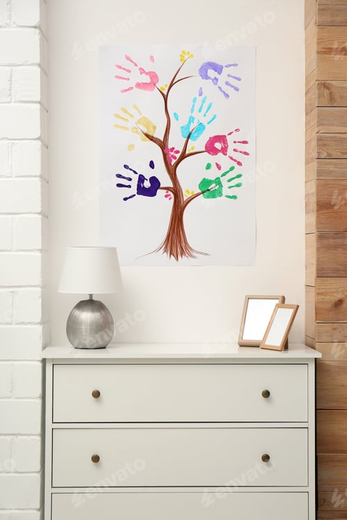 Vista previa: Family tree drawing with colorful palm prints on wall at home