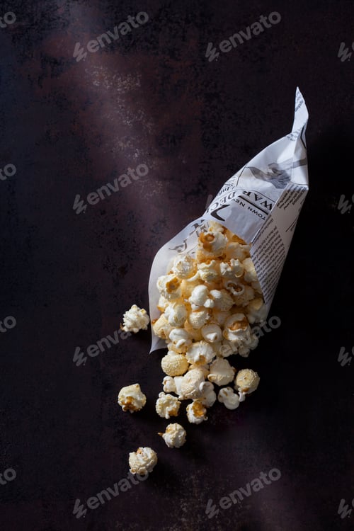 Preview: Paper bag of popcorn on rusty background