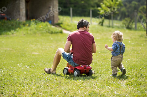 Preview: Father with his little son outside playing together