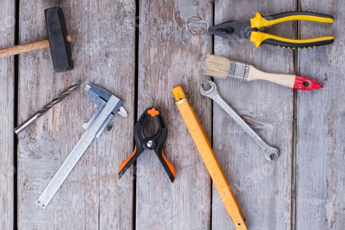 Preview: Top view of set of tools on wooden background.