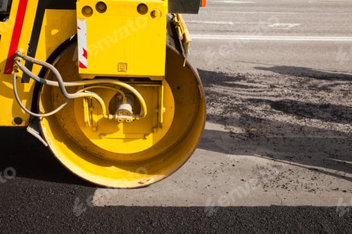 Preview: Pavement machine laying fresh asphalt or bitumen on top of the gravel base