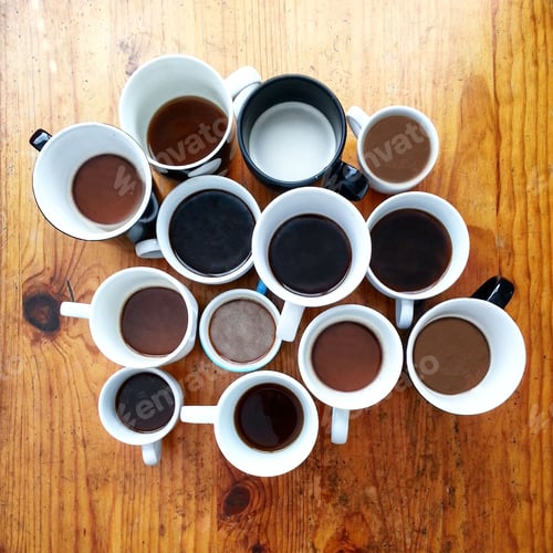 Preview: Directly above shot of multiple coffee cups on table top