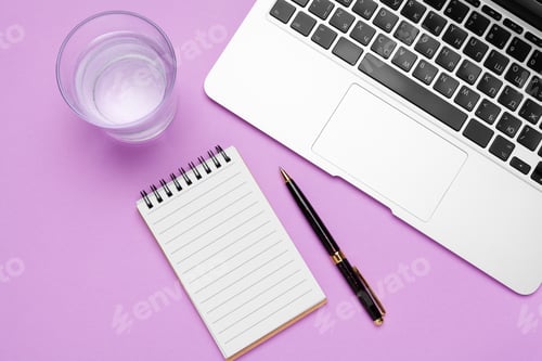 Preview: bottle of water on office table near laptop