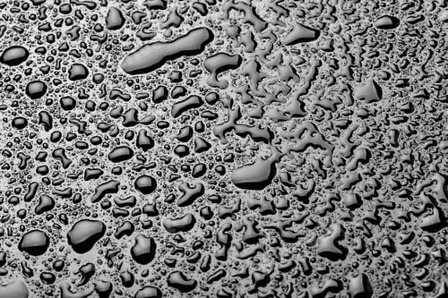 Preview: water drops splash on the black floor