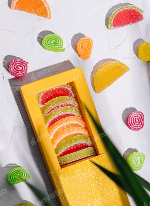 Preview: Multicolored marmalade in a box on top view
