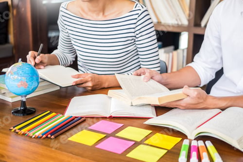Preview: Young students classmates help friend catching up workbook and learning tutoring in a library
