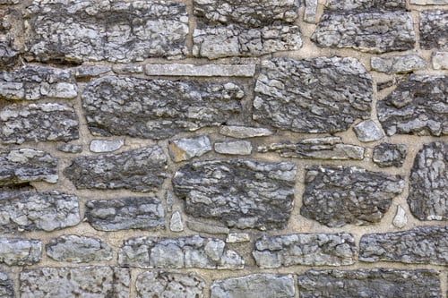 Preview: Old grey stone wall background, close up.