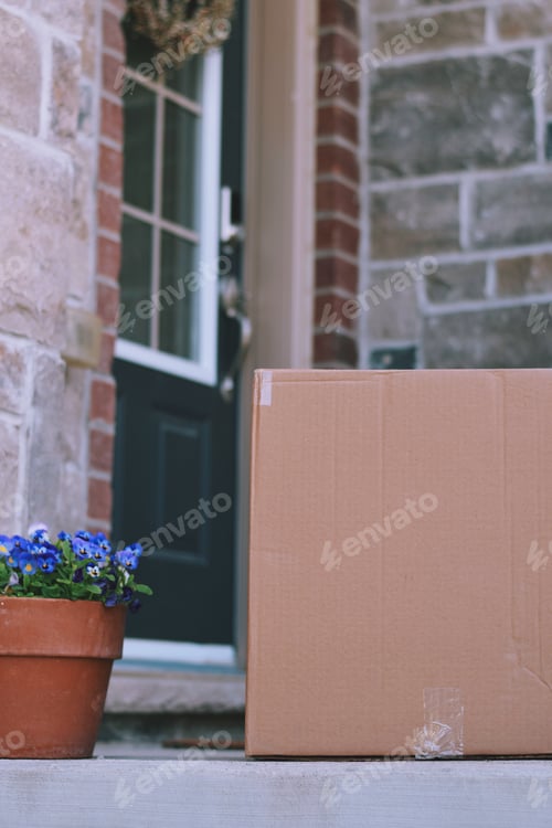 Preview: Parcel package delivery on a porch at the front door