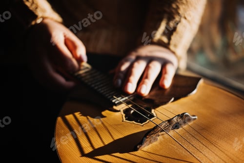 Preview: Domra Folk Musical Instrument. Female hands with 4 strings Natural Wood Handmade Musical Instrument